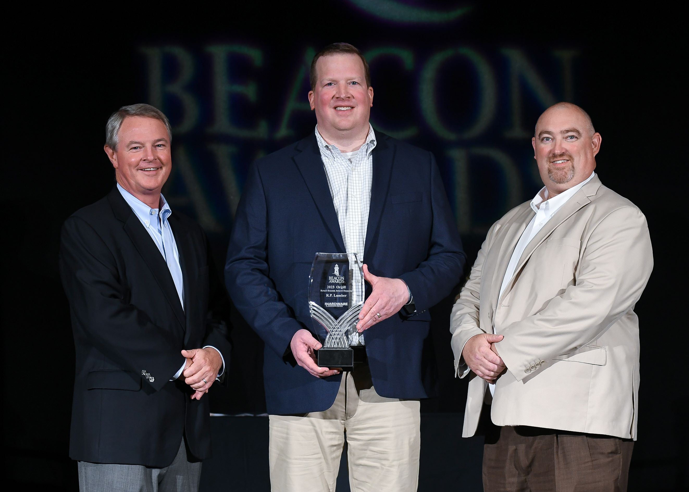 (L – R): Boyden Moore, CEO of Orgill, Jason Plummer, Vice President of R.P. Lumber, and Chris Bunch, Corporate Account Manager with Orgill